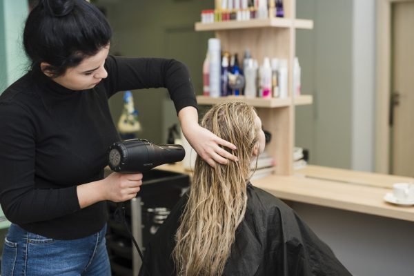 blonde-girl-getting-her-hair-dried