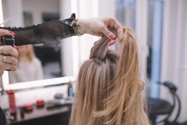 woman-doing-hairstyle-client